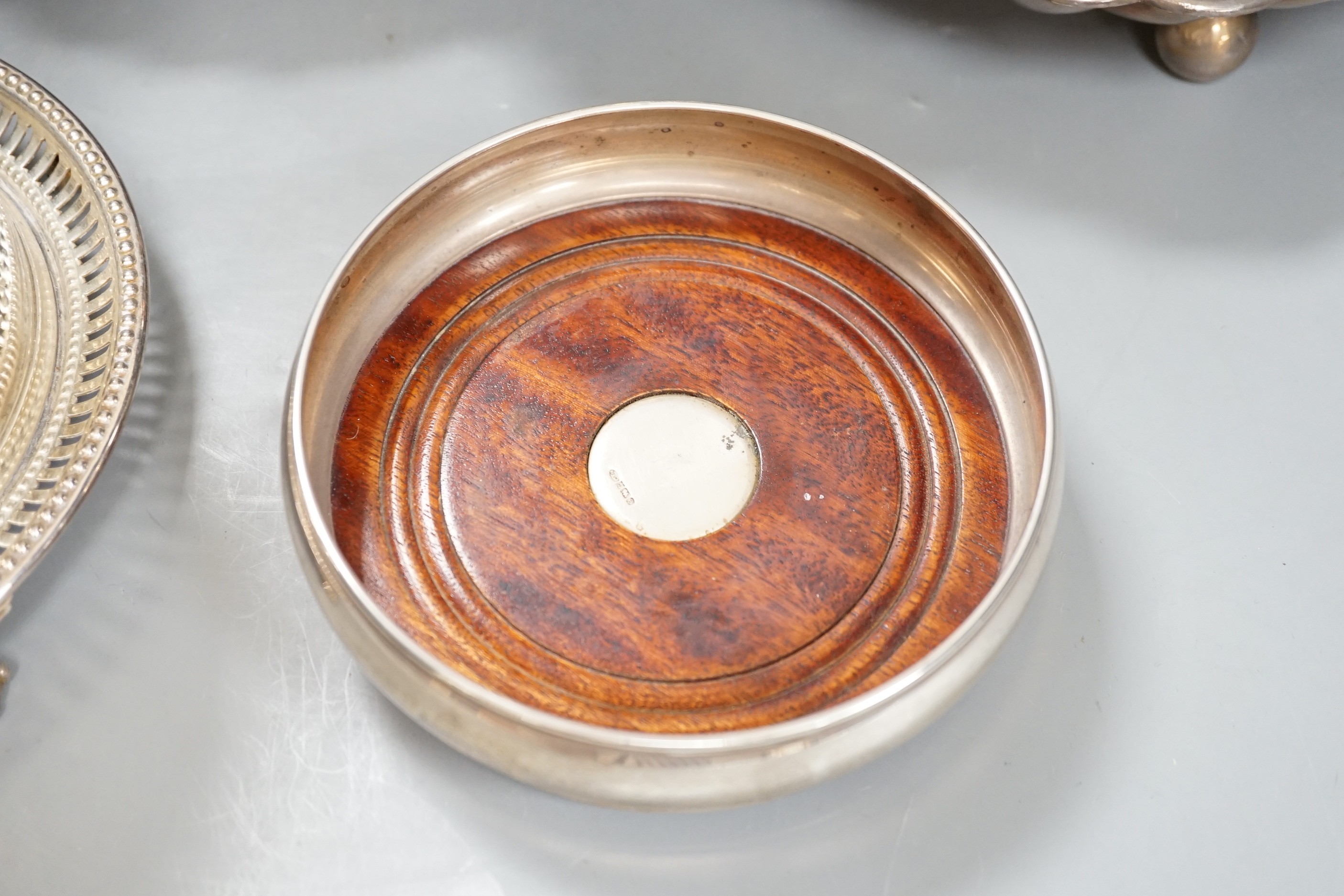 A silver plated strawberry and cream stand with a silver mounted coaster, and a plated biscuit barrel